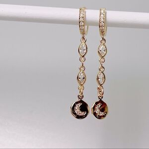 Gold huggie hoops with celestial moon charms for women and gift giving